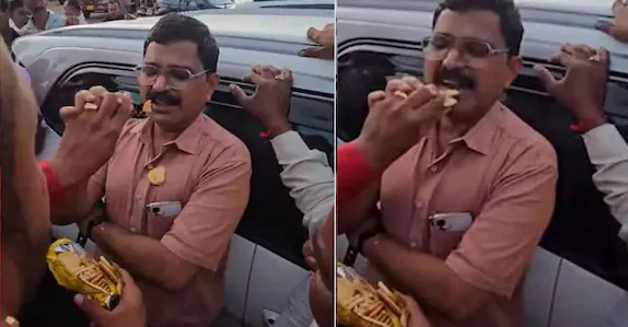 കൈക്കൂലി വാങ്ങി കേസ് ഒതുക്കി, കാലാവധി കഴിഞ്ഞ ബിസ്കറ്റ് ഉദ്യോഗസ്ഥന്റെ വായിൽ തിരുകി ജനക്കൂട്ടം
