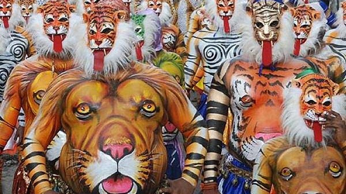 ചായം പൂശിയ വയറുകളും മേളപ്പെരുക്കവും; പുലിവേഷത്തിന് പിന്നിലെ ആരും കാണാത്ത വിയർപ്പും സമർപ്പണവും